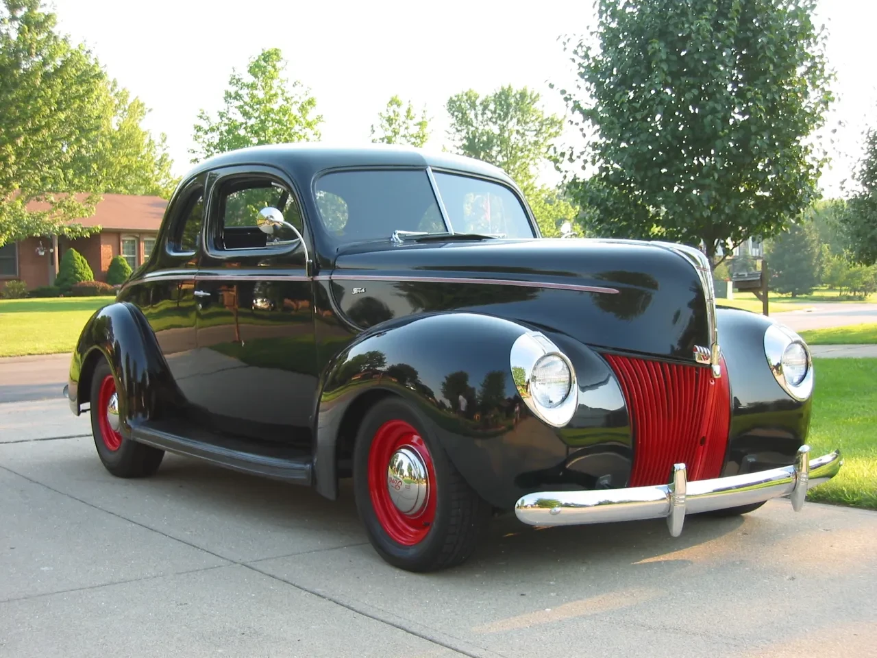Vintage black coupe red grille
